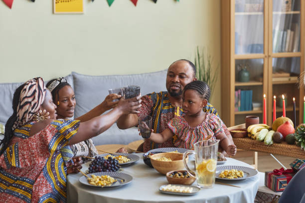 istock Family toasting with drinks celebrating holiday 1425283917