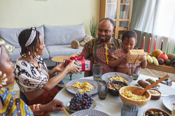 istock Family giving presents during holiday 1425283924