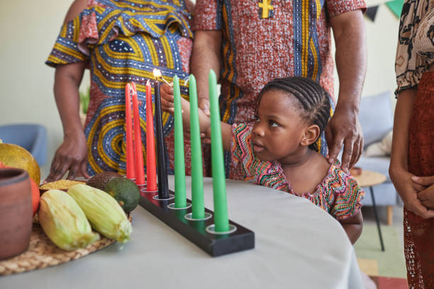 istock African litte girl lighting candles 1425283944