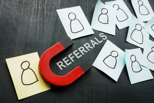 istock Referrals concept. Magnet and stickers with figures. 1425284015