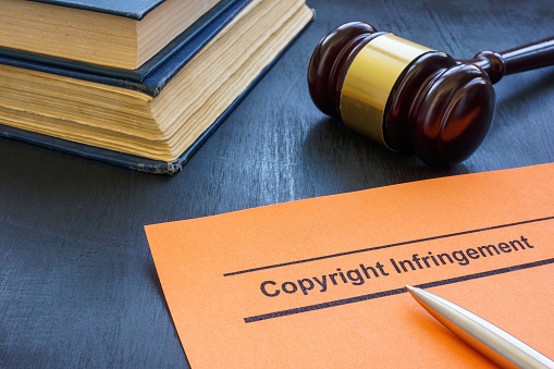 Document about copyright infringement and gavel.