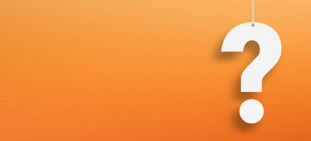 istock White question mark suspended by rope with copy space on orange background 1425284644