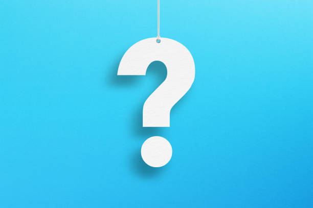 istock White question mark suspended by rope on blue background 1425284685