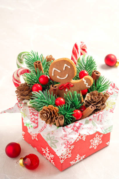 Christmas Decorations with Gingerbread man cookie and Gift Box.