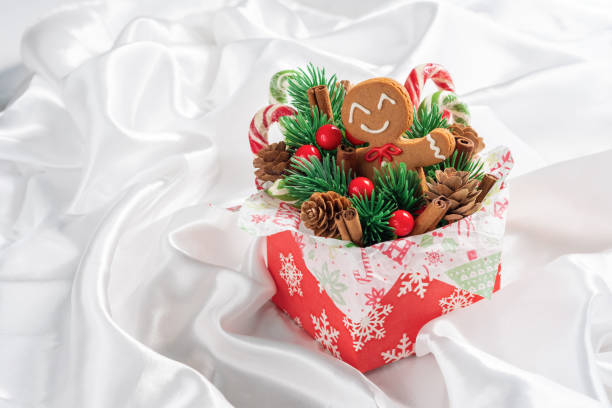 Christmas Decorations with Gingerbread man cookie and Gift Box.