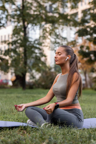 istock Woman clearing her mind and meditating in park 1425293274