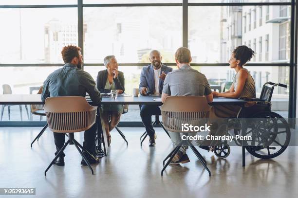 Disability Diversity And Business Meeting With Staff People Or Team Communication Planning On Corporate Strategy Goal Or Mission For Kpi Woman In Wheelchair In Group Talking Of Company Inclusion Stock Photo - Download Image Now