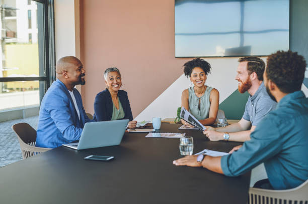 istock Business meeting, office teamwork and strategy with kpi paper data, laptop technology or company growth research. Smile, happy or manager with vision with businessman planning future partnership deal 1425293655