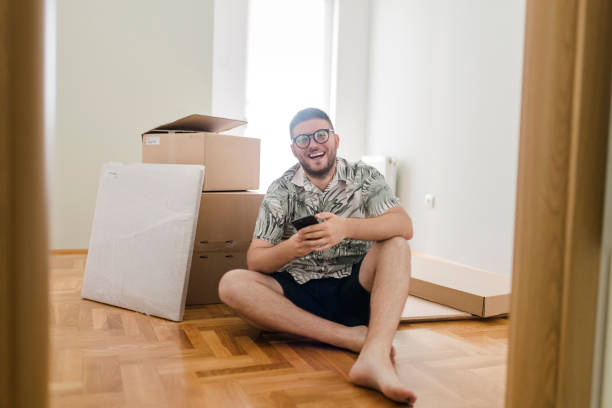 istock Young man using his phone to shop online at home 1425294996