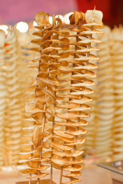 istock Spiral potato chips on a wooden stick 1425295740