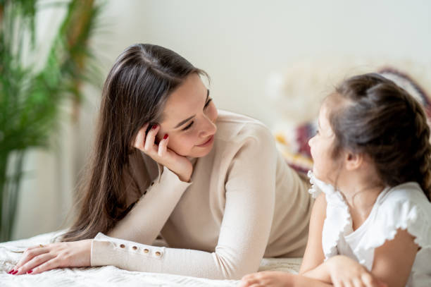 istock Mother and daughter laughing together 1425299438