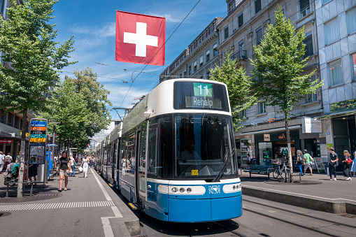 Zurich, Switzerland - July 11, 2022: modern Streetcar travelling on Bahnhofstrasse in Zurich.