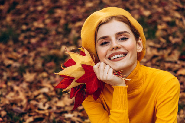 istock Beautiful woman enjoying autumn 1425302774