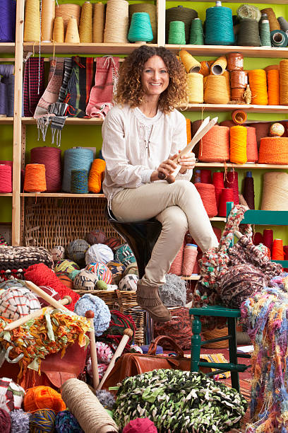 istock Woman Sitting On Stool Holding Knitting Needles 142530398