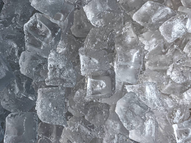 Stock photo showing close-up, elevated view of ice cube wall paper background.