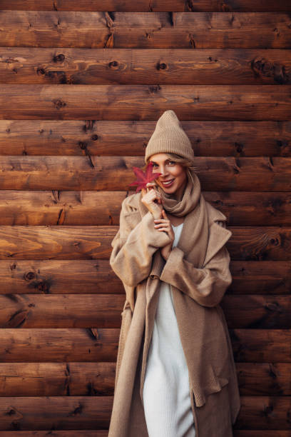 istock Beautiful woman holding a leaf 1425304178