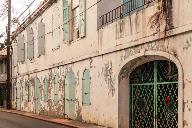 istock Old warehouse with second floor offices has shuttered windows and doors in St Thomas, US Virgin Islands 1425307802