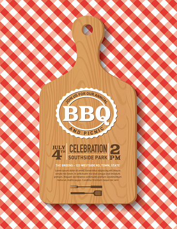 BBQ invitation template on a cutting board over a checked tablecloth. Text is on its own layer for easier removal.
