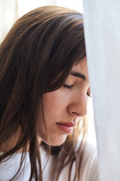 istock Close-up of a sad woman crying with depressive problems 1425308637