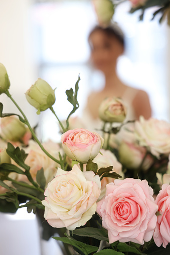 Pink peonies in womans hands. Beautiful peony flower for catalog or online store. Floral shop concept . Beautiful fresh cut bouquet. Flowers delivery.