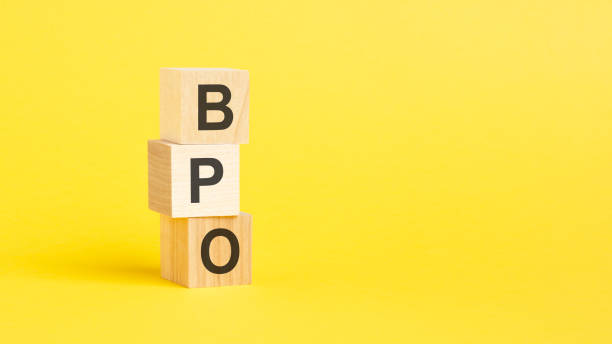 istock BPO - text on wooden cubes, on yellow background 1425312750