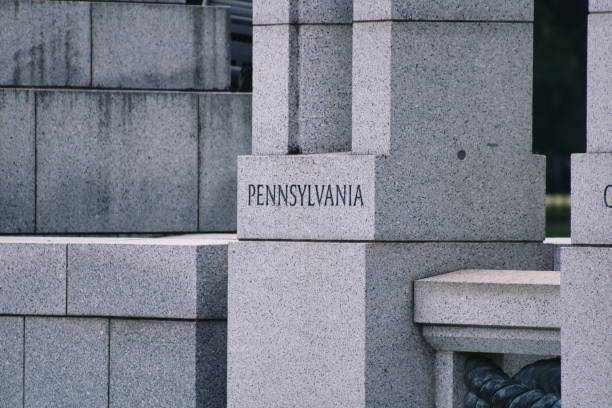 Pennsylvania inscription at the World War II Memorial Close-up of the inscription of Pennsylvania on a pillar at the World War II Memorial in Washington, D.C. washington pennsylvania stock pictures, royalty-free photos & images
