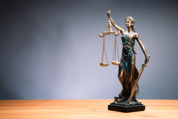 istock The Statue of Justice - lady justice on table 1425319304
