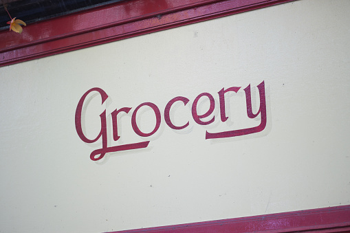 Grocery sign painted on building