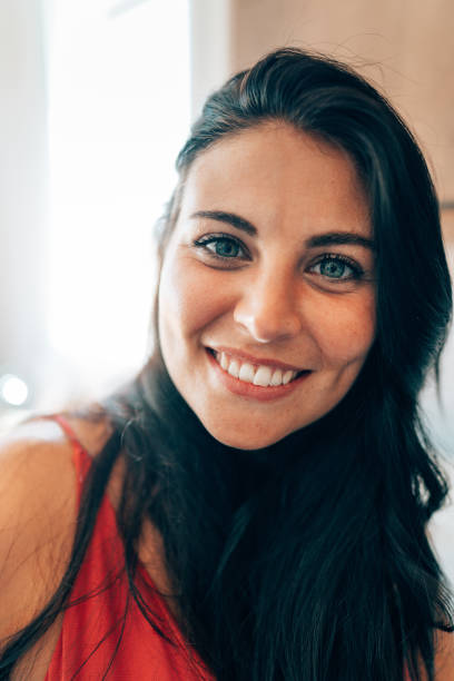 istock smiling brunette woman portrait 1425331305