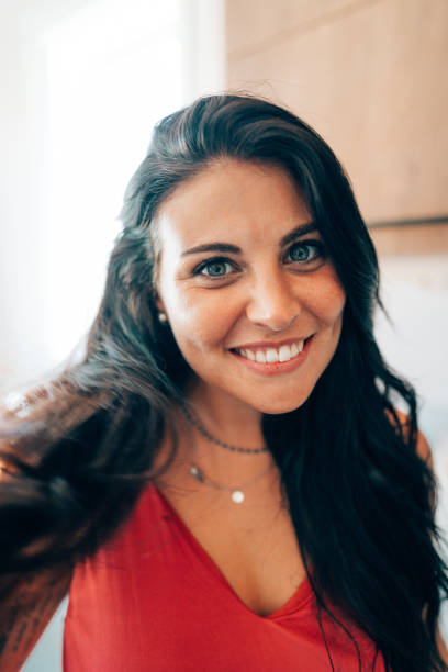 istock smiling brunette woman portrait 1425331337