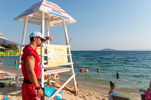 Lifeguard on Lagomandra beach to ensure safety on the beach. Bathing season in Greece.Summer vacation