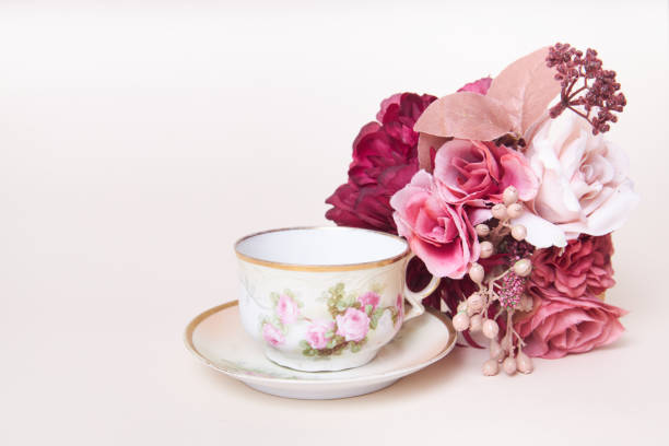 Garden cups, flowers and spring print china tea set for a calm morning in a backyard or park with a hot drink. Outdoors floral porcelain crockery catering for a relax, zen and quiet day in nature