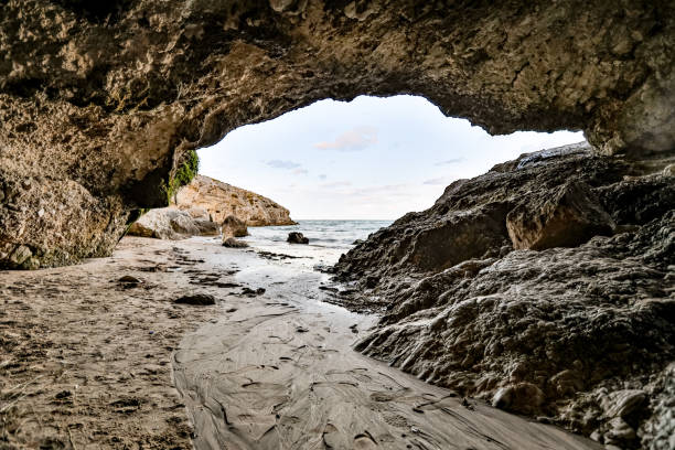 istock View at a horizon from under the sea arch - Baia Beach 1425345456