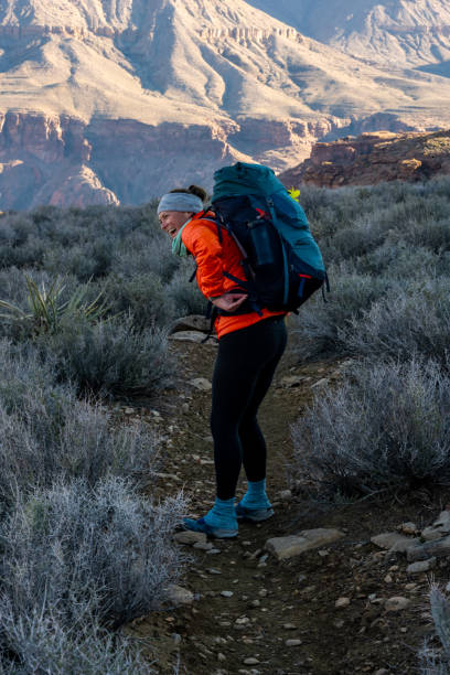 istock Female Backpacker Laughing In The Grand Canyon 1425346767