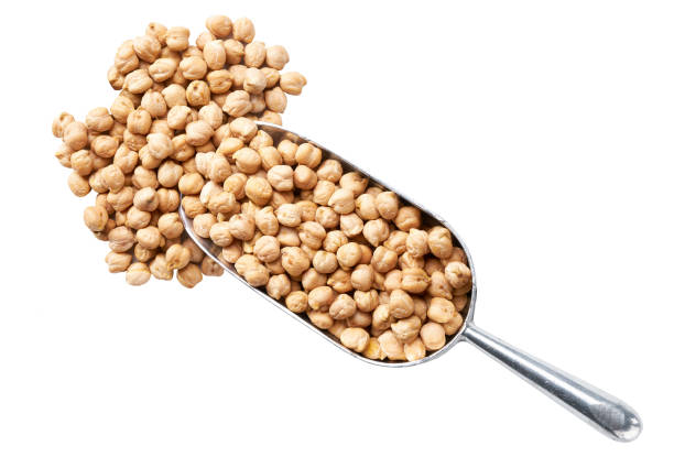istock metal spoon or scoop with raw chickpeas isolated on white background top view. 1425346831