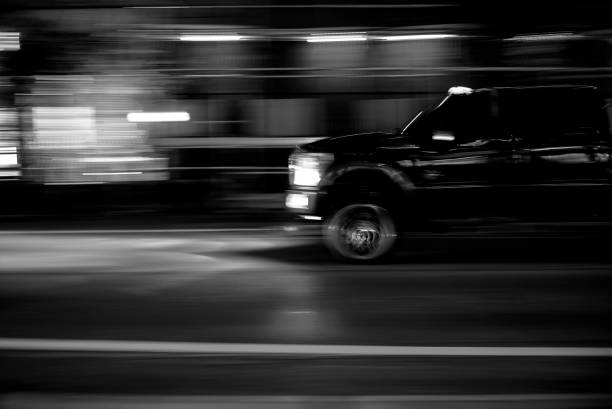 istock BLACK PICK-UP TRUCK IN BLURRED MOTION. 1425347251