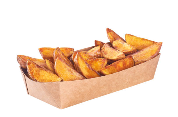 istock fried potato wedges in paper box isolated on a white background. 1425352515