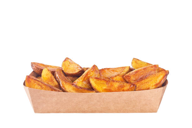istock fried potato wedges in paper box isolated on a white background. 1425352526