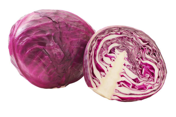 istock Whole and half red cabbage isolated on white background. 1425355973