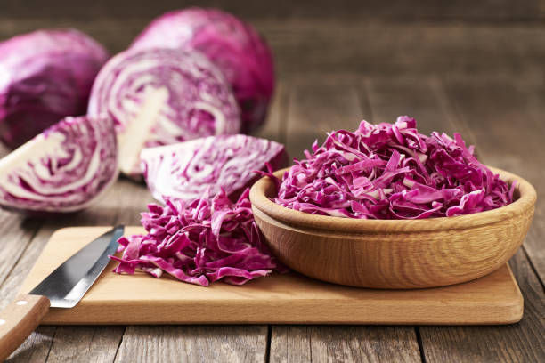 istock Fresh red cabbage or purple cabbage or blaukraut on a wooden table with copy space for text. 1425356020