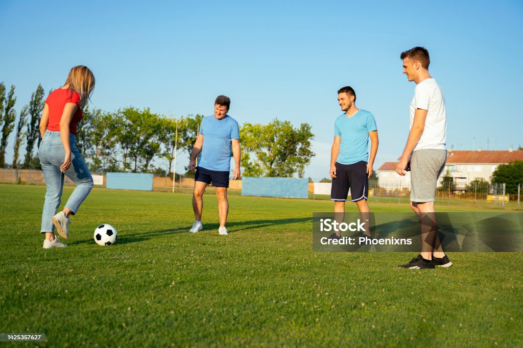 Group of people deferent age playing soccer for fun, team building Soccer Stock Photo