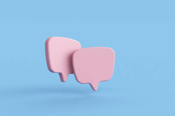 istock Two pink bubble talk or comment sign symbol on blue background. 1425367544