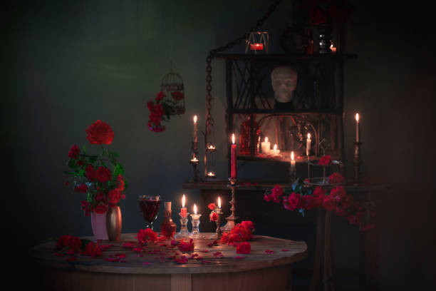 istock magic potion with red roses and burning candles in dark room 1425367968