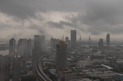 Bangkok, Thailand - Sep 08, 2022 : Morning time scene with Heavy fog cross of various skyscrapers at Bangkok city. Selective Focus.