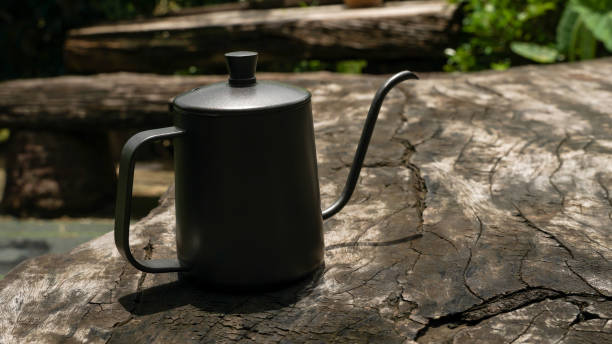istock The drip coffee set includes coffee beans, drip kettle and a coffee grinder.  place on wooden table 1425380348