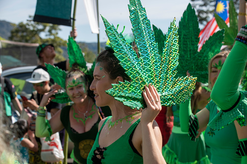 Nimbin, NSW; September 18, 2022\nGanga Faery at the Nimbin 30th Mardi grass. Part of a group marching and dancing for Cannabis reform for 30 years.\n\n30th Mardi Grass. Every year the small NSW town of Nimbin {famous for the 1973 Aquarius Festival} holds a rally to march for the legalisation of cannabis. Law reform still has a long way to go even for the use of medicinal cannabis. The parade has a large number of colourful characters. It is a non ticketed public event. There are also sports games and a two day conference in  the town hall on the nature and future of cannabis. A feature of the parade is a group of dancing Ganja Faeries. They range form 8 to 80 and rehearse a travelling dance all year.