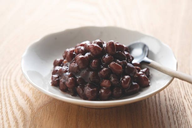 istock Boiled azuki beans placed against a wooden background. 1425382719