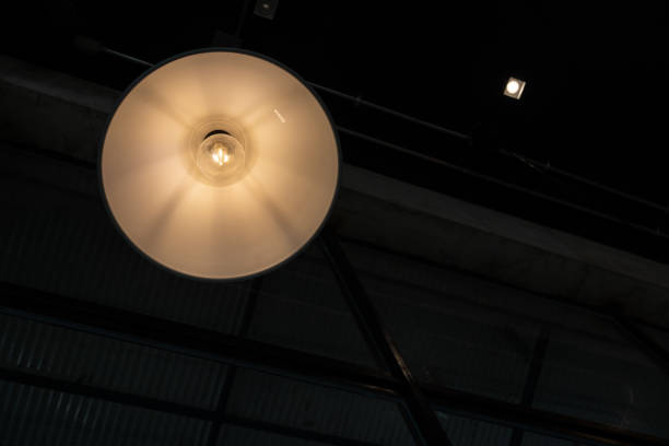 istock warm lights hanging from ceiling in local restaurant. 1425383741
