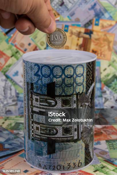 Piggy Bank With The Image Of A Banknote Of 20000 Kazakhstani Tenge Against The Background Of Other Kazakhstani Banknotes Stock Photo - Download Image Now