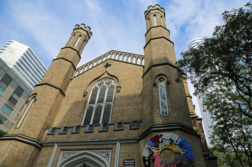 The front of Anglican church built in gothic revival style in 1847 - City centrum of Toronto, Ontario, Canada